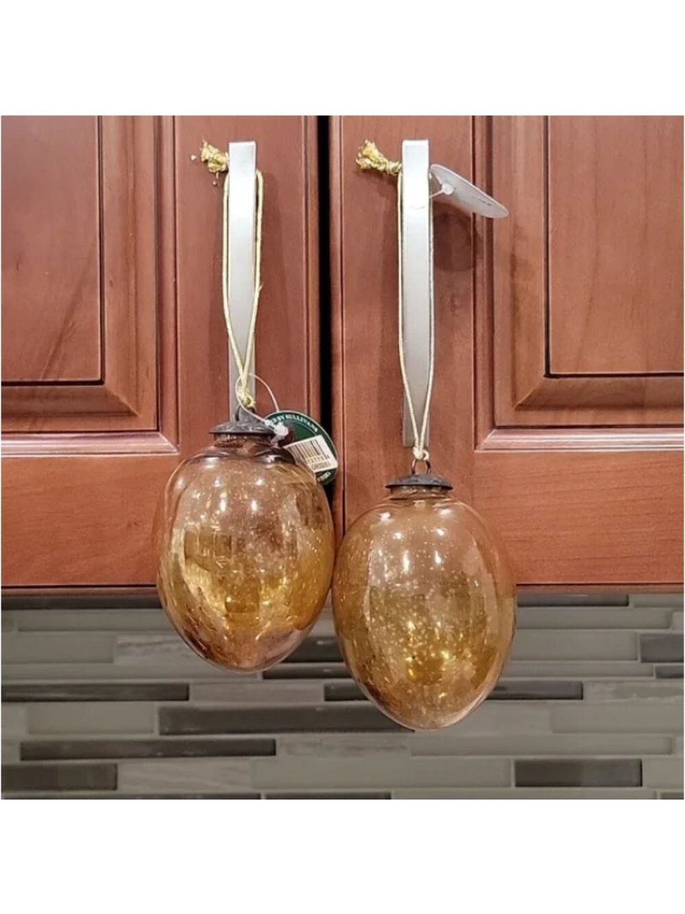 Set of two Sullivans handblown glass Amber colored ornaments